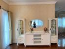 Bedroom with a vanity dresser and glass display cabinets