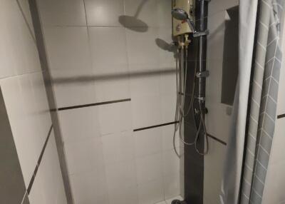 Shower area with electric water heater