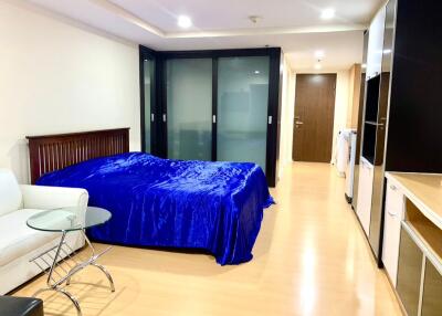 Bedroom with blue bedding and modern amenities