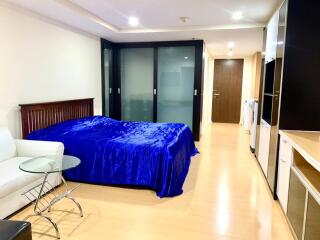 Bedroom with blue bedding and modern amenities