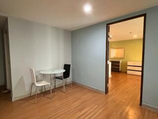 Modern unfurnished dining area with a view into the kitchen