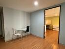 Modern unfurnished dining area with a view into the kitchen