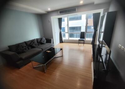 Modern living room with large windows and contemporary furniture