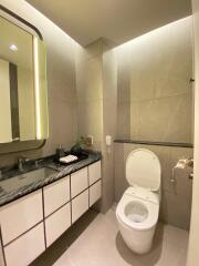 Modern bathroom with toilet and vanity unit