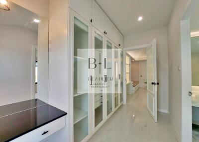 Spacious hallway with built-in storage and desk