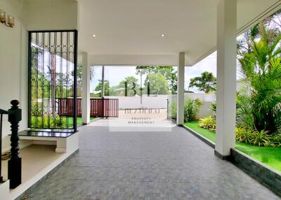 spacious outdoor patio with garden view