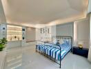 Modern bedroom with metal bedframe, shelves, and decor