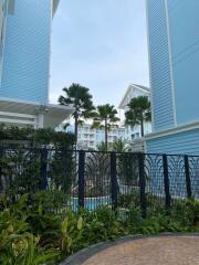 Exterior view of a residential building with garden area