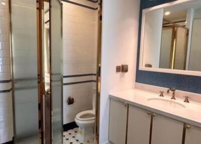 Modern bathroom with glass shower and dual sink vanity