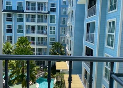 View of apartment buildings with a pool