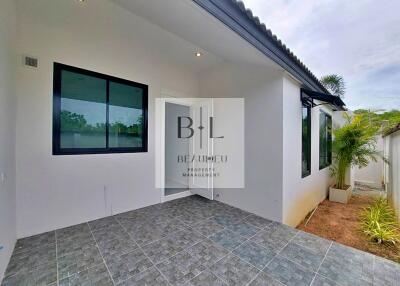 Modern house exterior with tiled patio