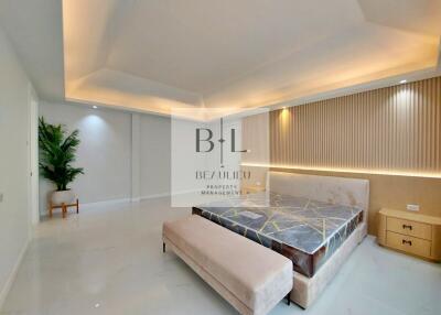 Modern bedroom with accent lighting and minimalist decor