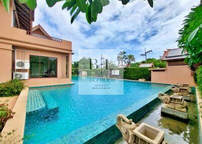 Outdoor pool area with a luxurious and spacious design