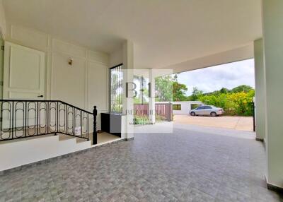 Spacious covered garage with tiled flooring