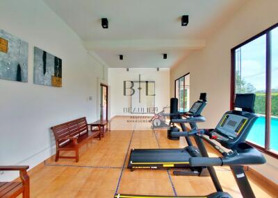 Gym with exercise equipment and benches