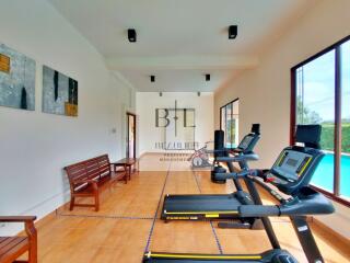 Gym with exercise equipment and benches