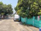 Street view with cars and trees