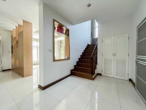 Modern hallway with stairs leading to the second floor