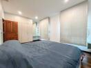 Spacious bedroom with double bed and ample storage