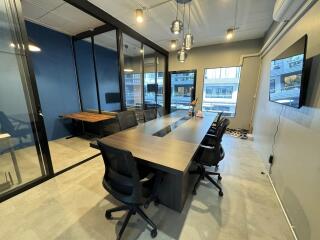 Modern conference room with glass walls and large table