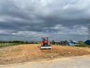 Construction site with machinery and dirt road in progress