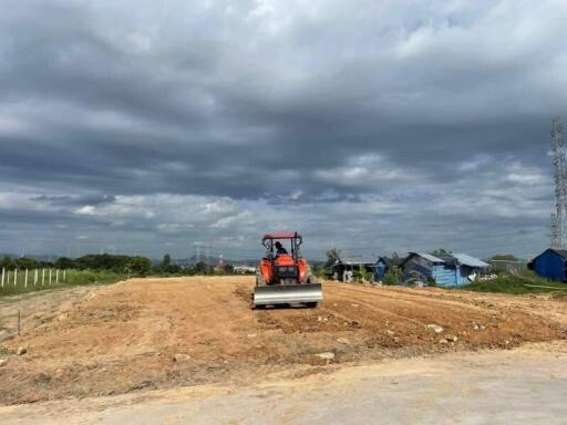 Construction site with machinery and dirt road in progress