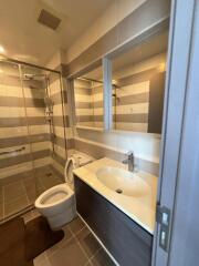 Modern bathroom with shower, toilet, and sink