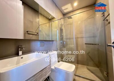 Modern bathroom with glass shower and sink