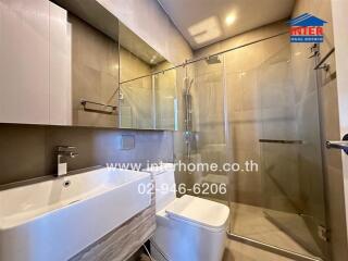 Modern bathroom with glass shower and sink