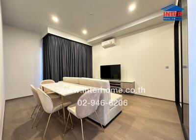 Modern living room with dining area and TV