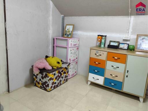 Bedroom with colorful storage units and plush toys