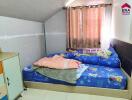 Bedroom with bed and children's bedding