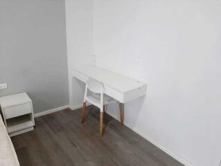 Minimalist bedroom with desk and chair