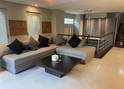 Modern living room with sectional sofa and decorative pillows