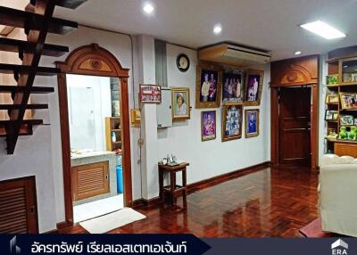 Spacious living area with wooden flooring and decorative elements