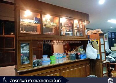 Wooden kitchen shelves with various items