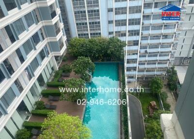 Aerial view of apartment complex with swimming pool