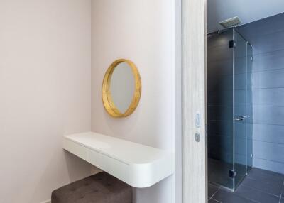 Minimalistic bathroom with a mirror and glass shower