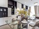 Modern dining area with glass table and open living space