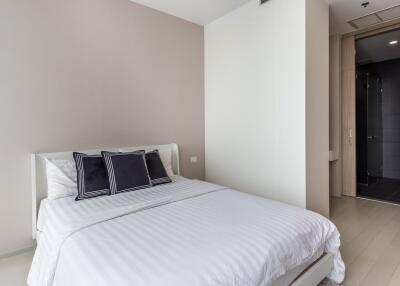 Modern bedroom with white bed and pillows