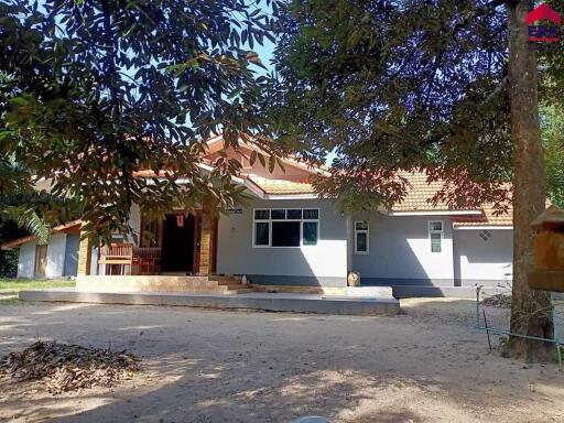 Exterior view of a house with a large front yard