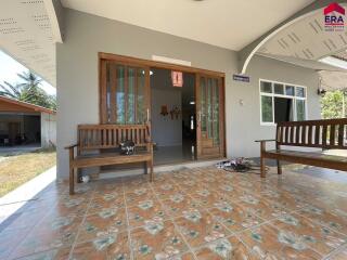 Front porch with wooden benches