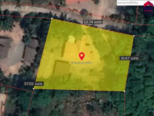 Aerial view of land plot with marked boundaries and measurements