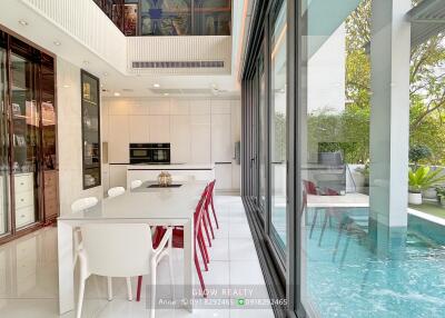 Modern dining area with pool view