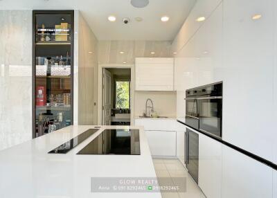 Modern white kitchen with high-end appliances and kitchen island