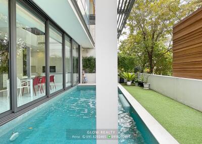 Outdoor view with swimming pool and garden area