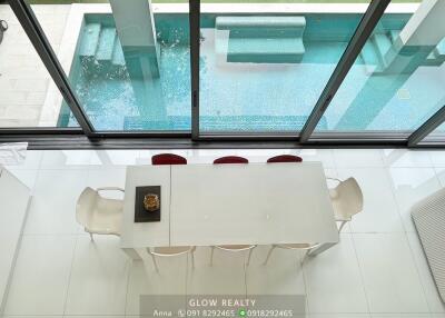 Dining area overlooking swimming pool