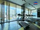 Modern gym with treadmills and large windows