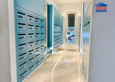 Modern building mailroom with multiple mailboxes