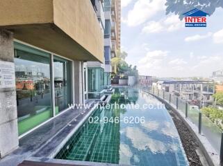 Exterior view of a building with a rooftop pool